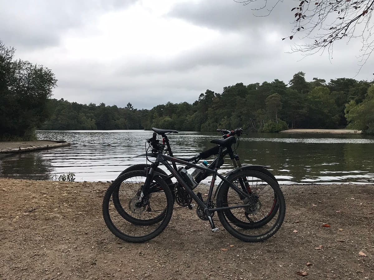 two mountain bikes leaning against each other in front of Hawley Lake